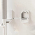 تعليقة عصاية تلزيق متعددة الاستخدام – بدون حفر — Self-Adhesive Multi-Purpose Mop Holder – No Drilling