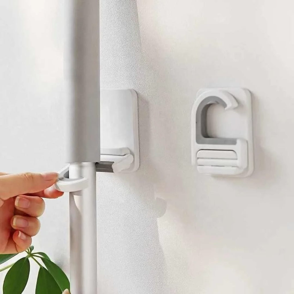 تعليقة عصاية تلزيق متعددة الاستخدام – بدون حفر — Self-Adhesive Multi-Purpose Mop Holder – No Drilling