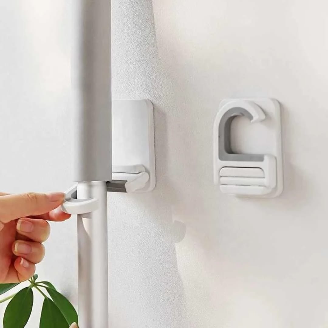 تعليقة عصاية تلزيق متعددة الاستخدام – بدون حفر — Self-Adhesive Multi-Purpose Mop Holder – No Drilling
