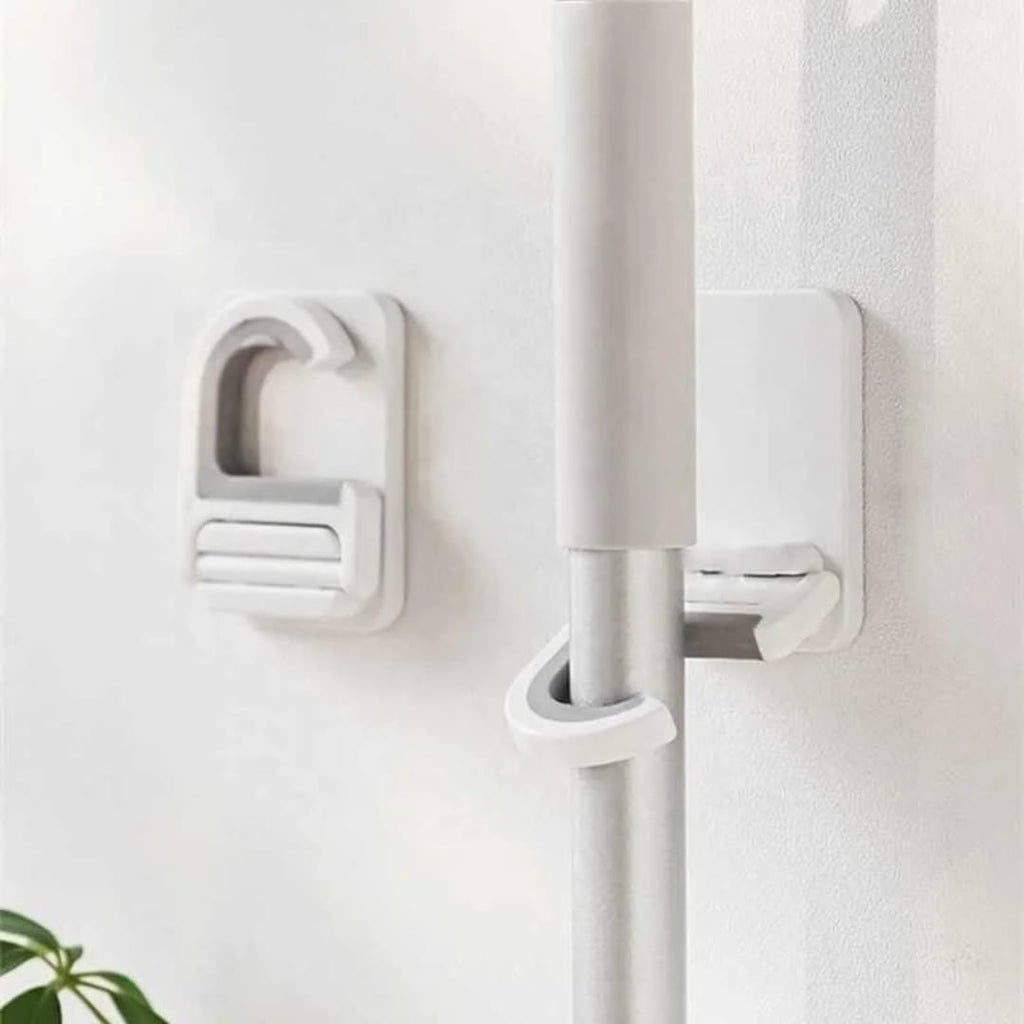 تعليقة عصاية تلزيق متعددة الاستخدام – بدون حفر — Self-Adhesive Multi-Purpose Mop Holder – No Drilling